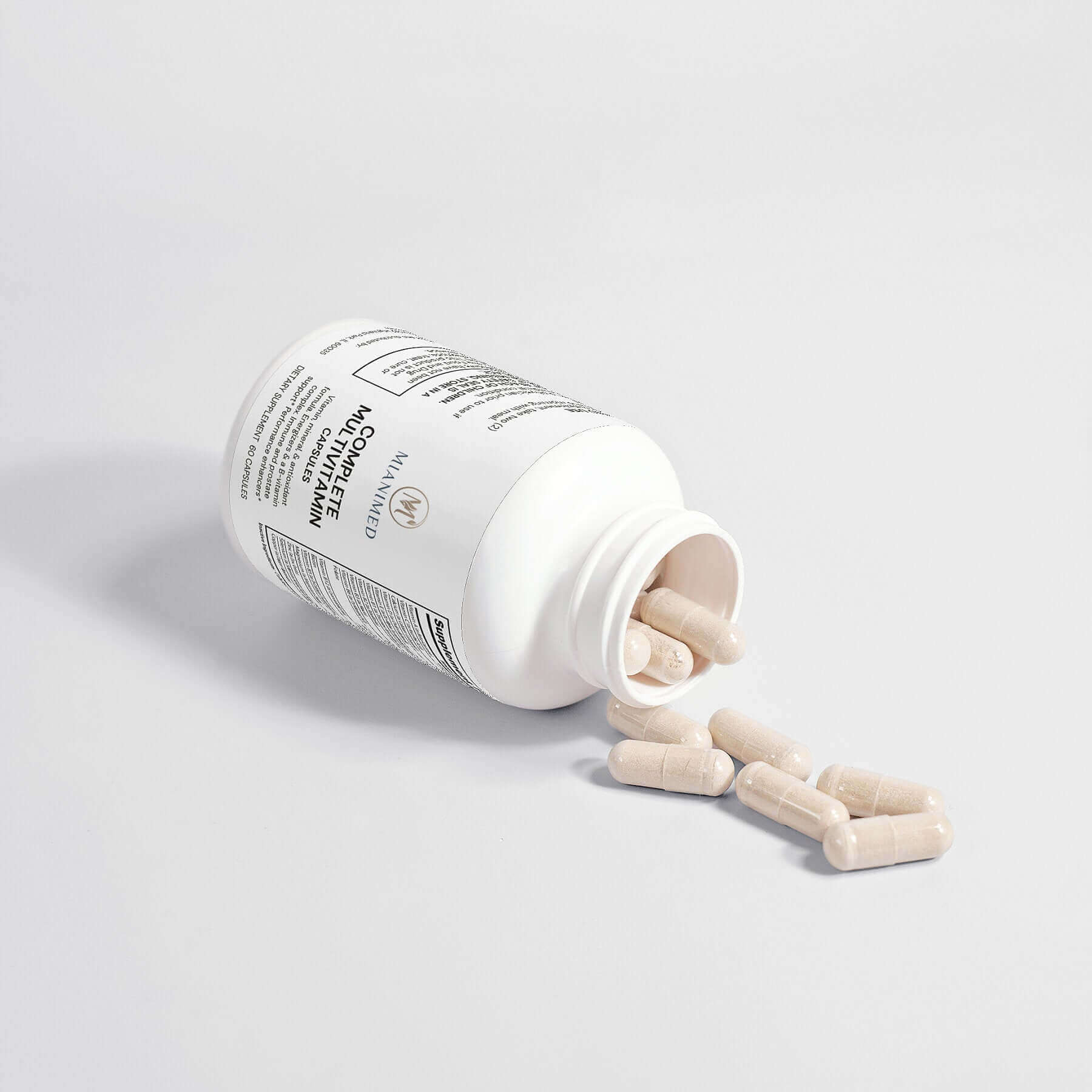 MIANIMED Premium skincare supplement capsules spilling from white bottle on light background