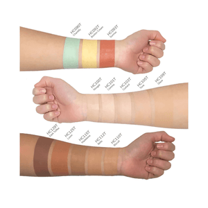 Various shades of concealer swatched on three arms displaying a range of skin tones from MIANIMED premium skincare collection