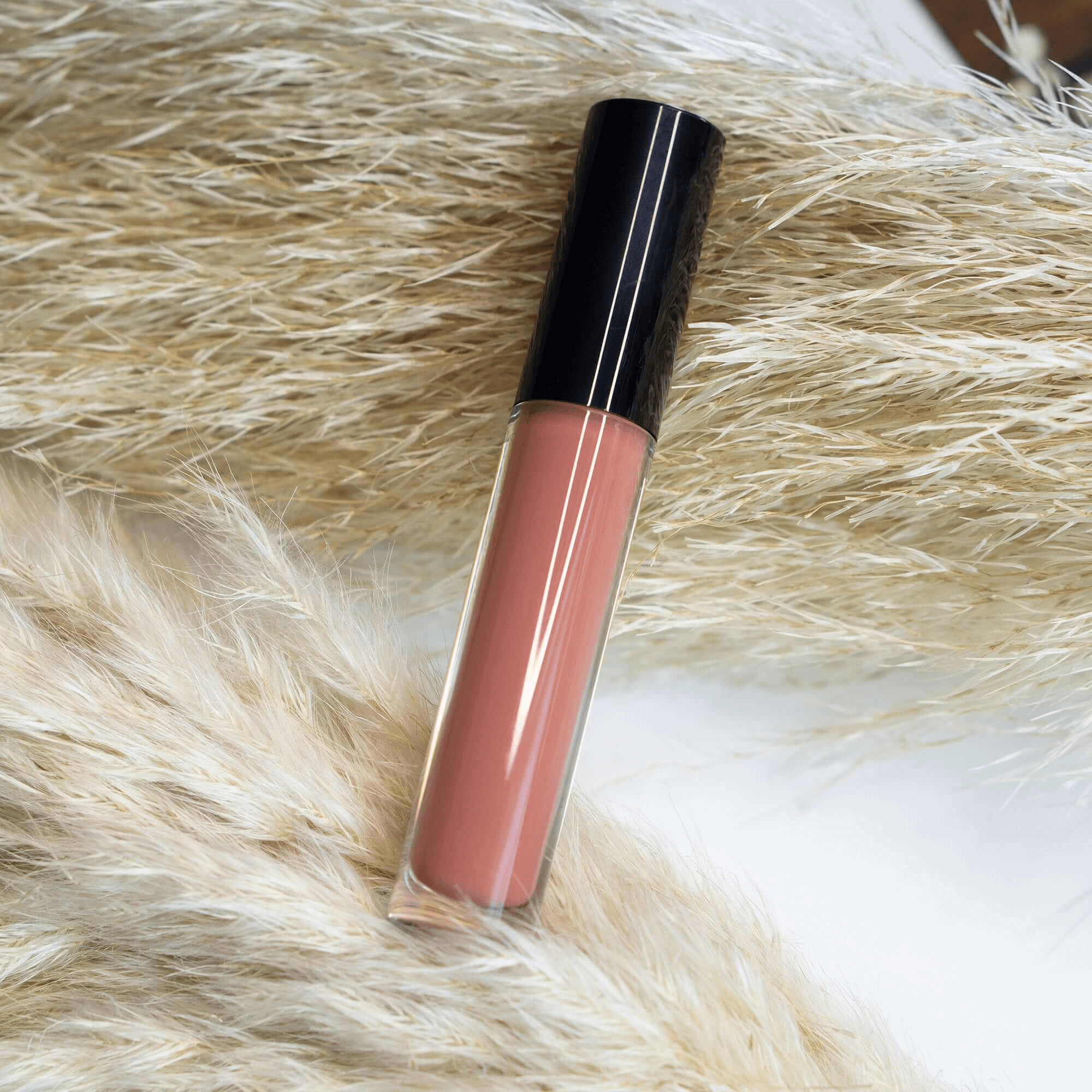 MIANIMED Premium Skincare Lip Gloss on Natural Grass Background