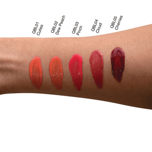 Arm displaying swatches of MIANIMED premium skincare lip tints in five shades: Cuties, Dew Peach, Pinch, Cloud, and Cherries.