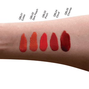 Arm showing swatches of five lipstick shades: QBLO1 Cuties, QBLO2 Dew Peach, QBLO3 Pinch, QBLO4 Cloud, QBLO5 Cherries.