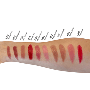 MIANIMED premium skincare lipstick swatches on forearm showing various shades from deep plum to vibrant red.