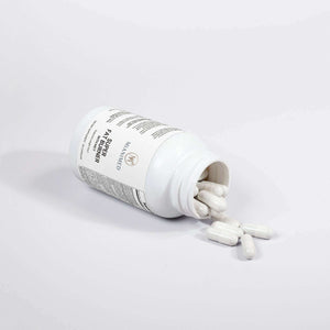 MIANIMED premium skincare supplement capsules spilling out of a white bottle