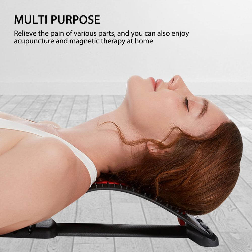 Woman using a multi-purpose back stretcher for pain relief with acupuncture and magnetic therapy at home.