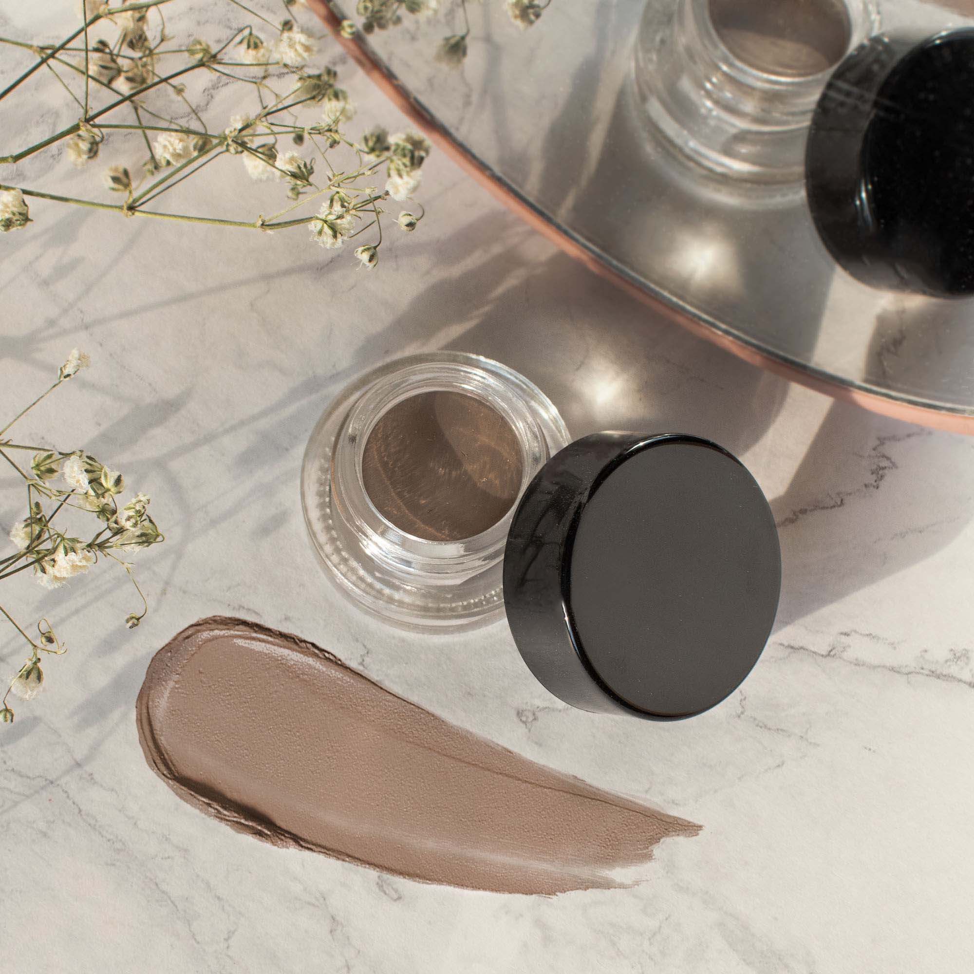 MIANIMED premium skincare product in a clear container with a black lid, showcasing a high-quality cosmetic cream.